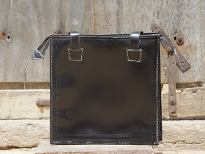 Black handstitched leather bag crafted from premium leather with meticulous handmade detailing