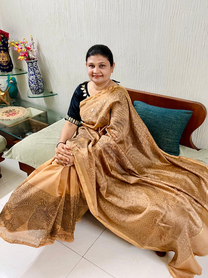 Elegant ancient gold saree showcasing detailed Mata Ni Pachedi artwork created by skilled artisans