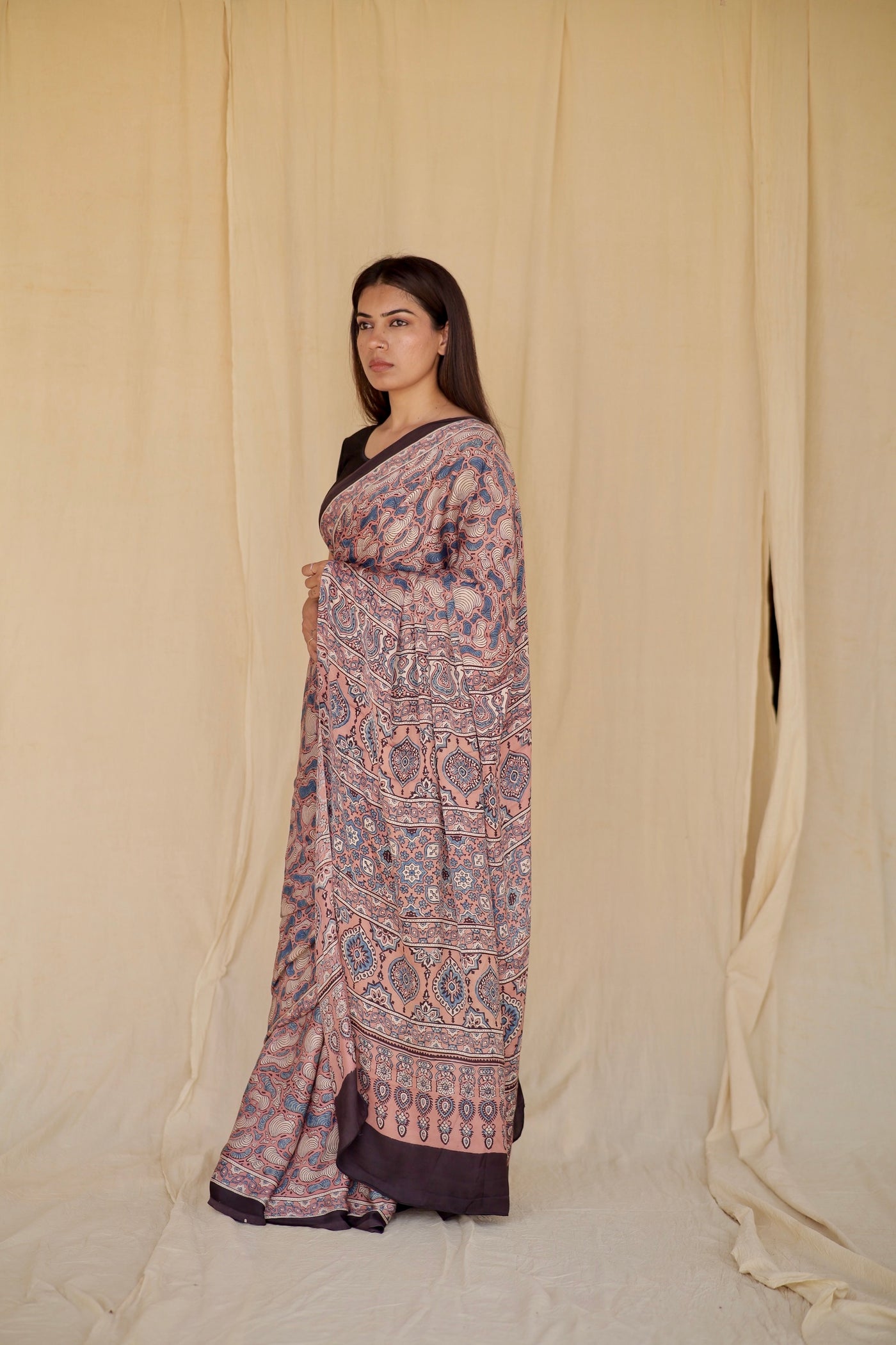Sophisticated antique rose Ajrakh saree in modal silk showcasing skilled artisan block printing techniques