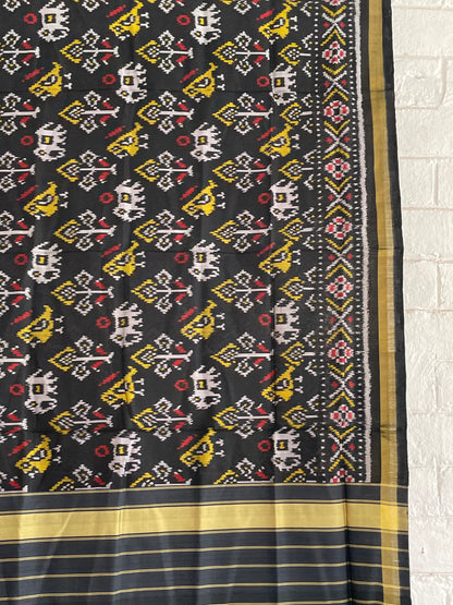 Handcrafted black Patola dupatta showcasing authentic Single Ikkat weaving artistry