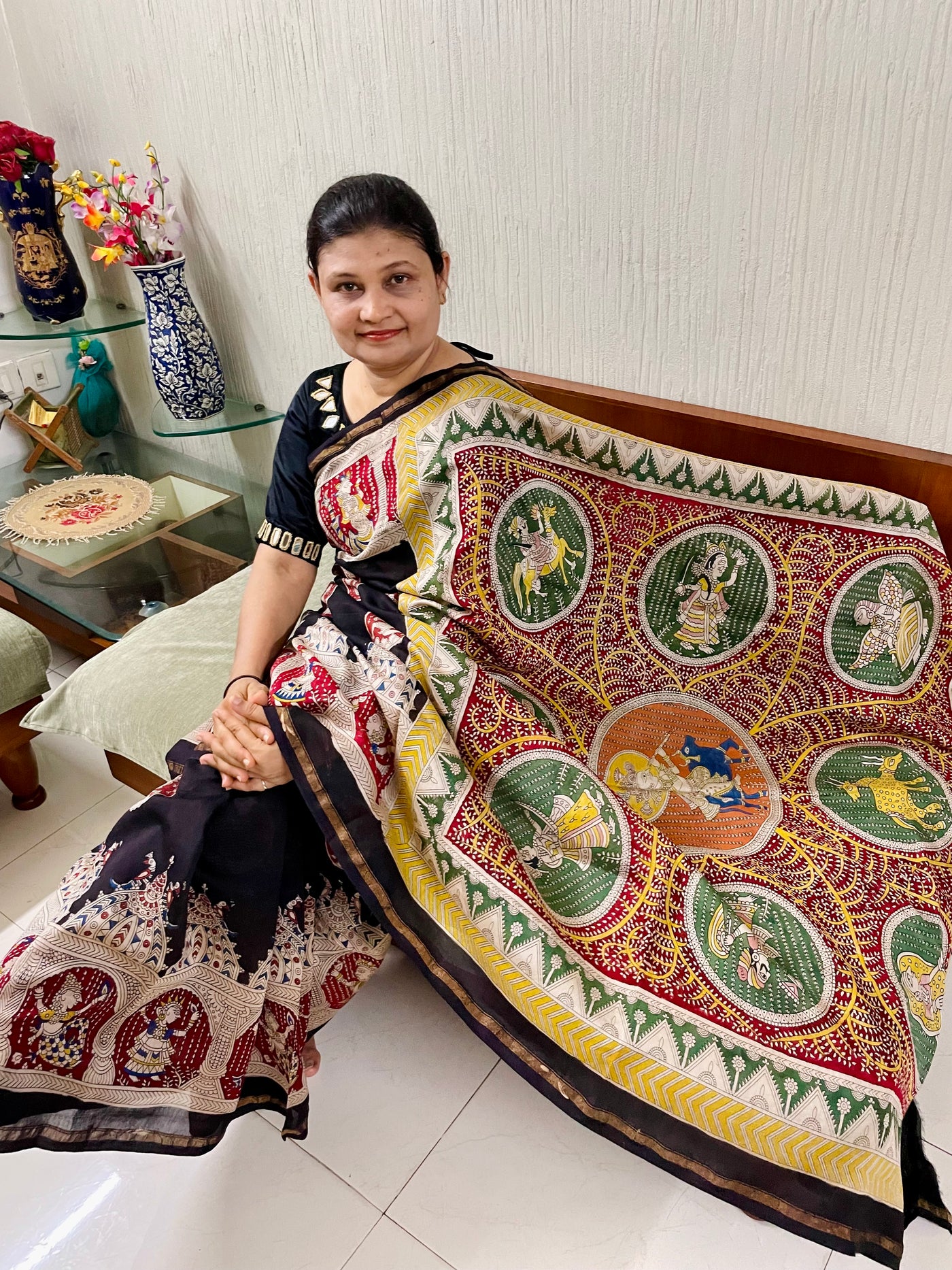Elegant black saree showcasing detailed Mata Ni Pachedi artwork created by skilled artisans