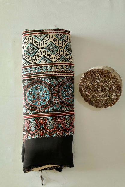 Elegant black sunflower Ajrakh saree crafted in luxurious modal silk with heritage-inspired designs