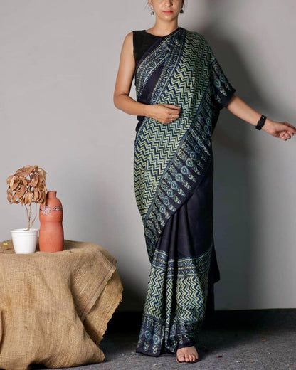 Traditional black and teal Ajrakh printed modal silk saree crafted by artisans with refined craftsmanship