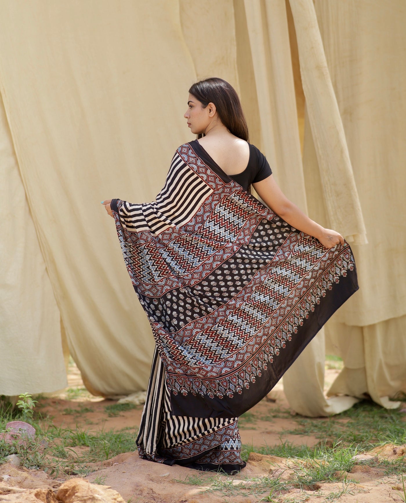Elegant black and white stripe Ajrakh saree in modal silk showcasing skilled artisan block printing techniques