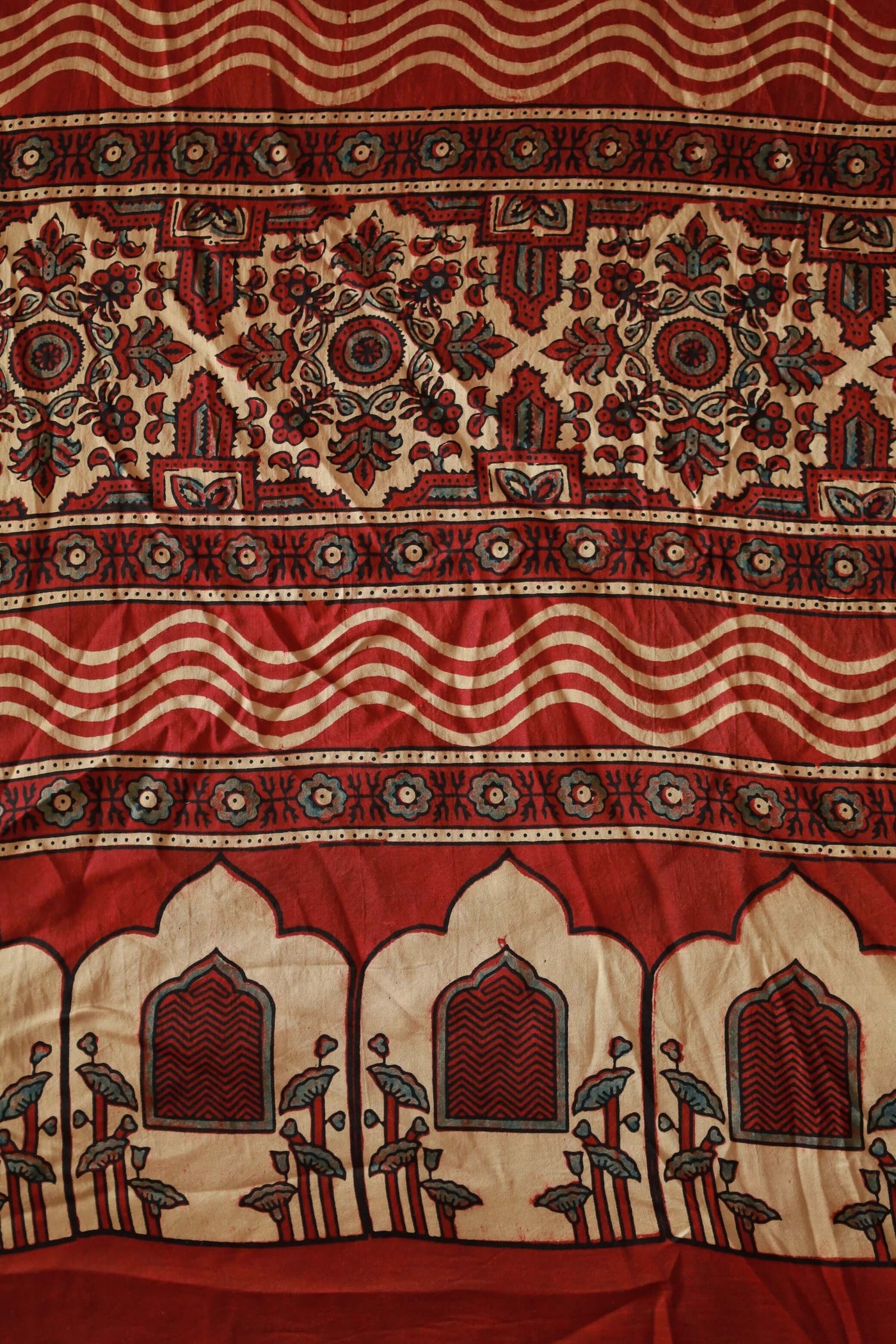 Elegant burgundy Ajrakh saree crafted in luxurious modal silk with heritage-inspired designs