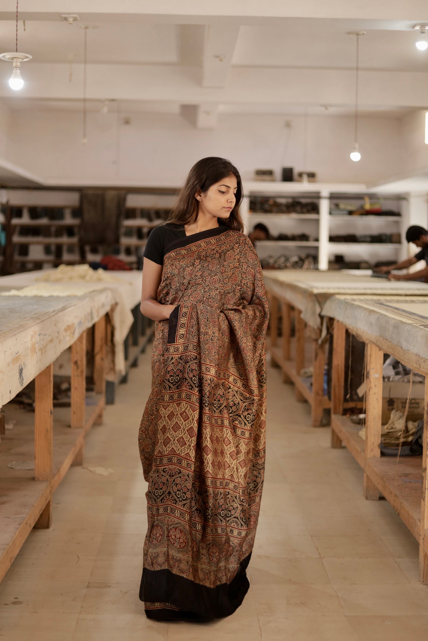 Elegant caramel brown Ajrakh saree crafted in luxurious modal silk with heritage-inspired designs