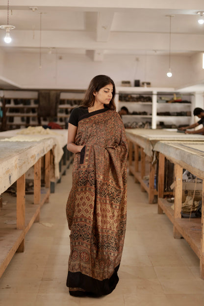 Elegant caramel brown Ajrakh saree crafted in luxurious modal silk with heritage-inspired designs