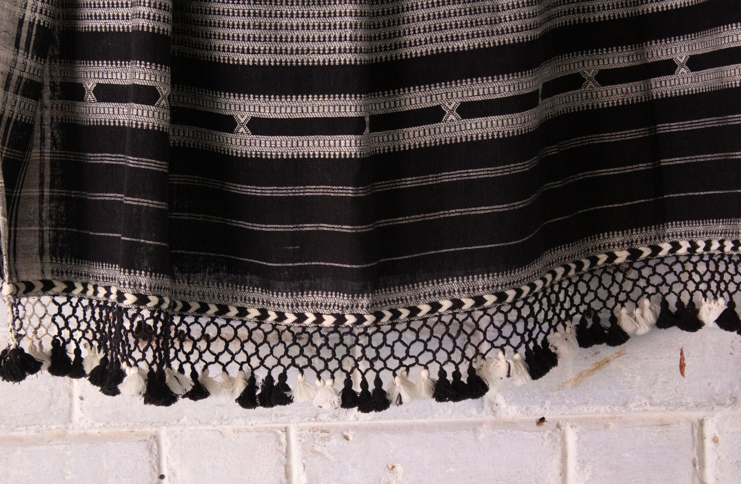 Elegant charcoal Bhujodi saree woven in sustainable Kala Cotton with intricate artisan detailing