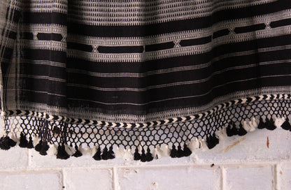 Elegant charcoal Bhujodi saree woven in sustainable Kala Cotton with intricate artisan detailing