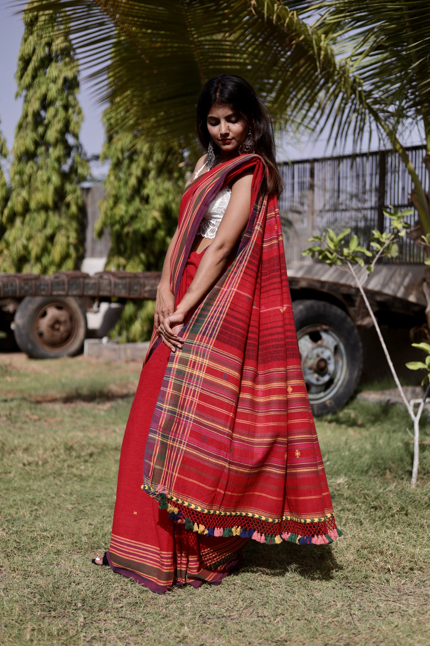 Elegant cherry Bhujodi saree woven in sustainable Kala Cotton with intricate artisan detailing