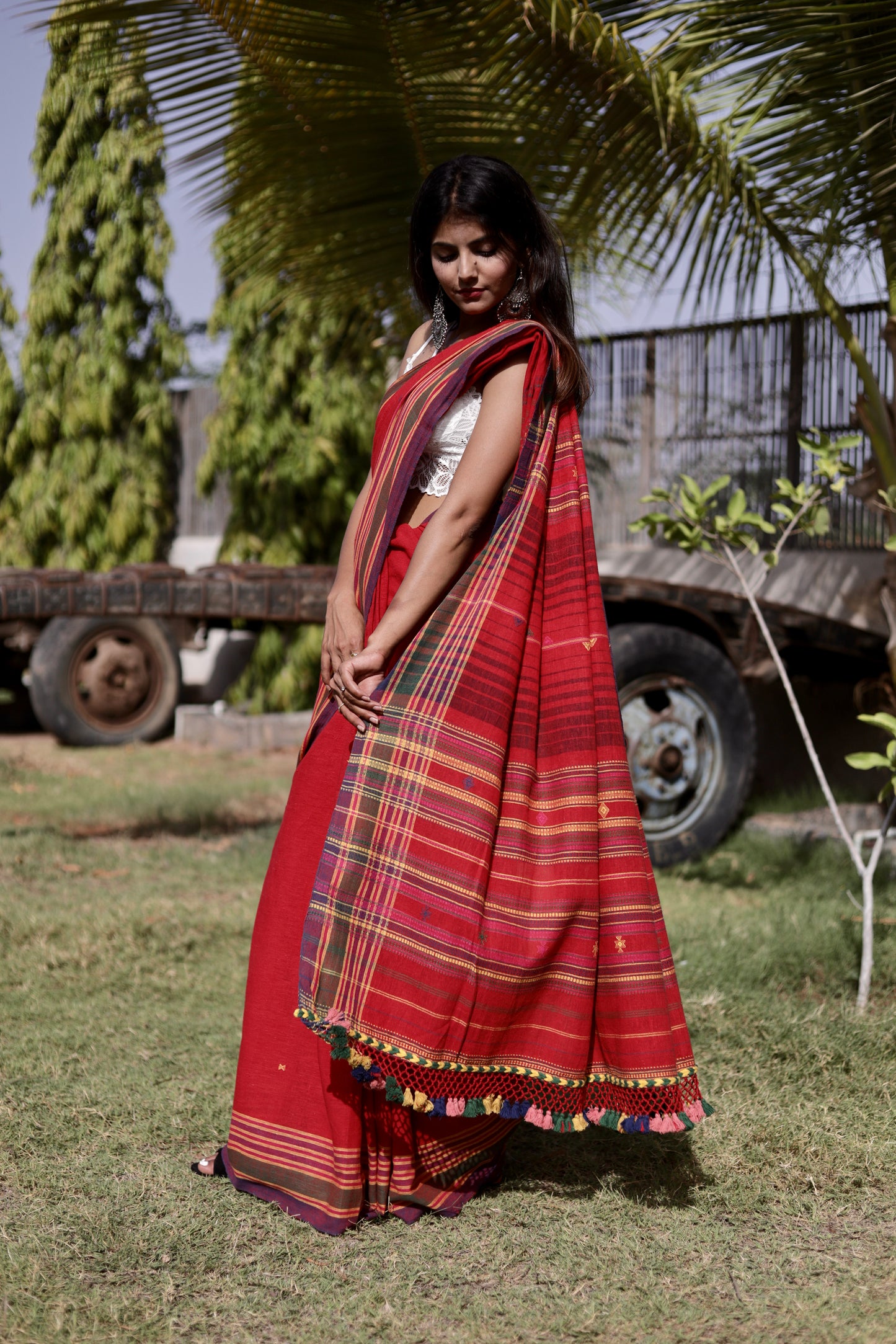 Elegant cherry Bhujodi saree woven in sustainable Kala Cotton with intricate artisan detailing
