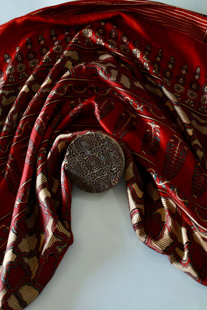 Elegant crimson red Ajrakh saree crafted in luxurious modal silk with heritage-inspired designs