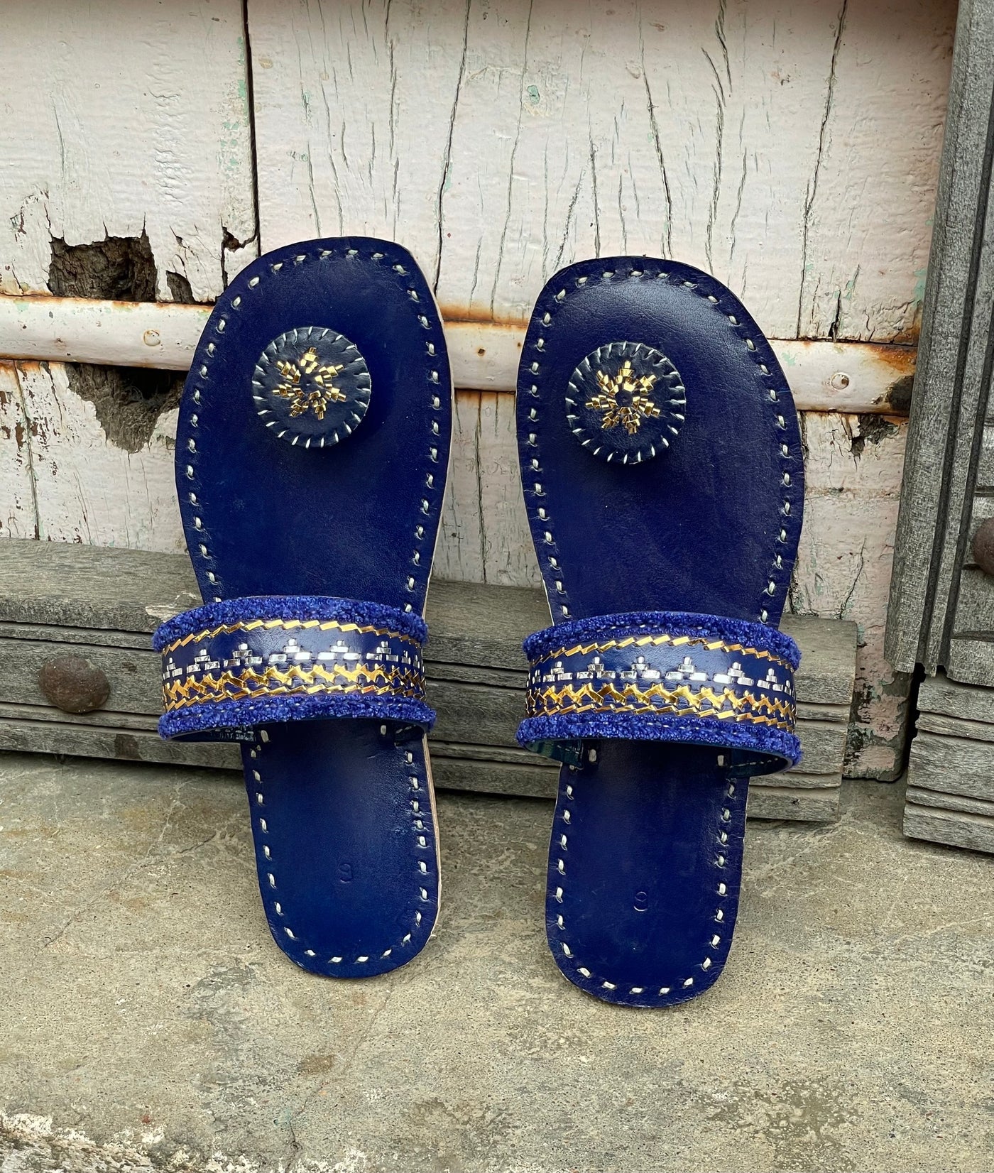 Premium dark blue handcrafted leather flats with fine artisan stitching details