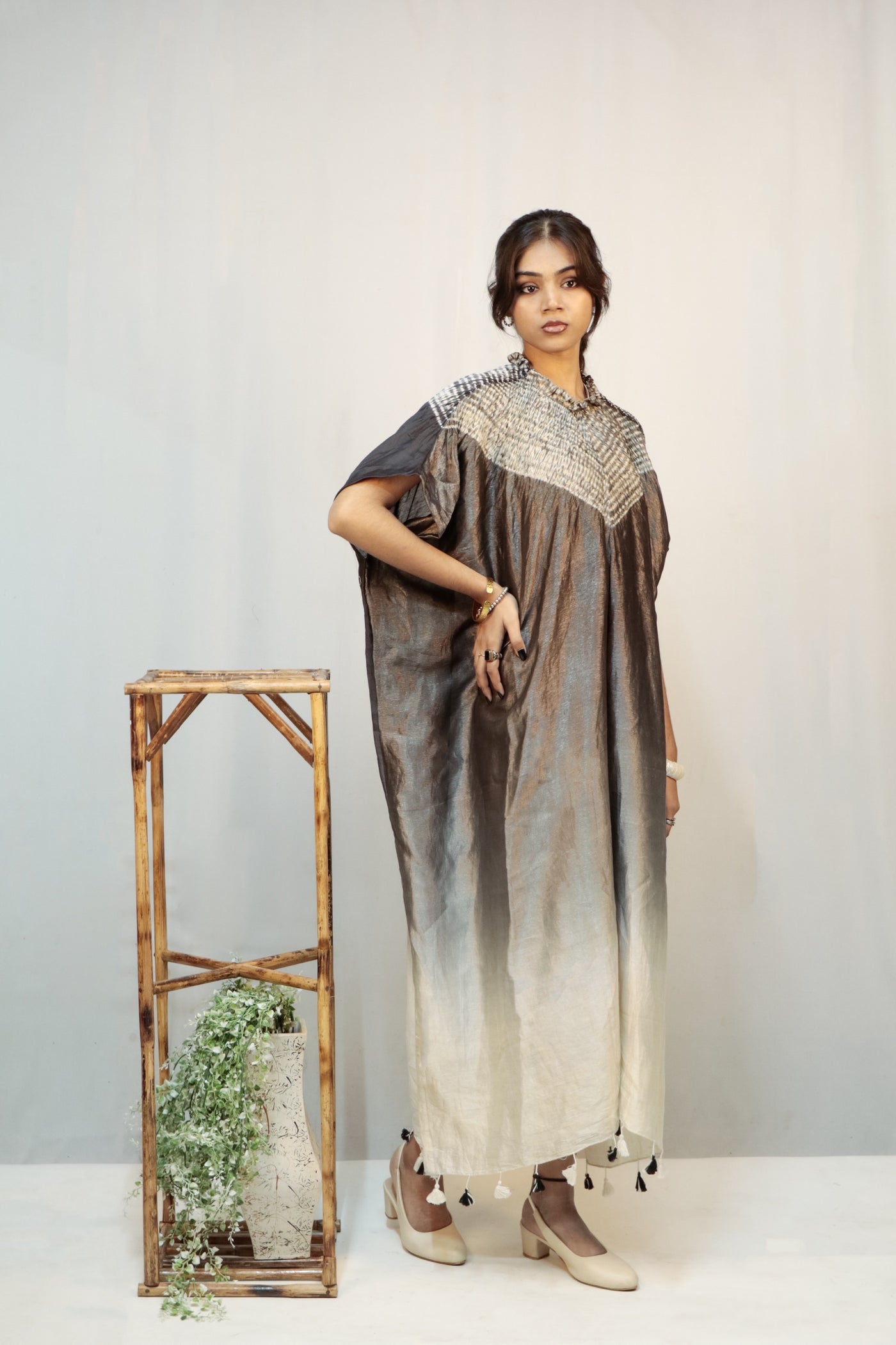 Handcrafted deep black silk kaftan featuring traditional Bandhani and Shibori textile artistry
