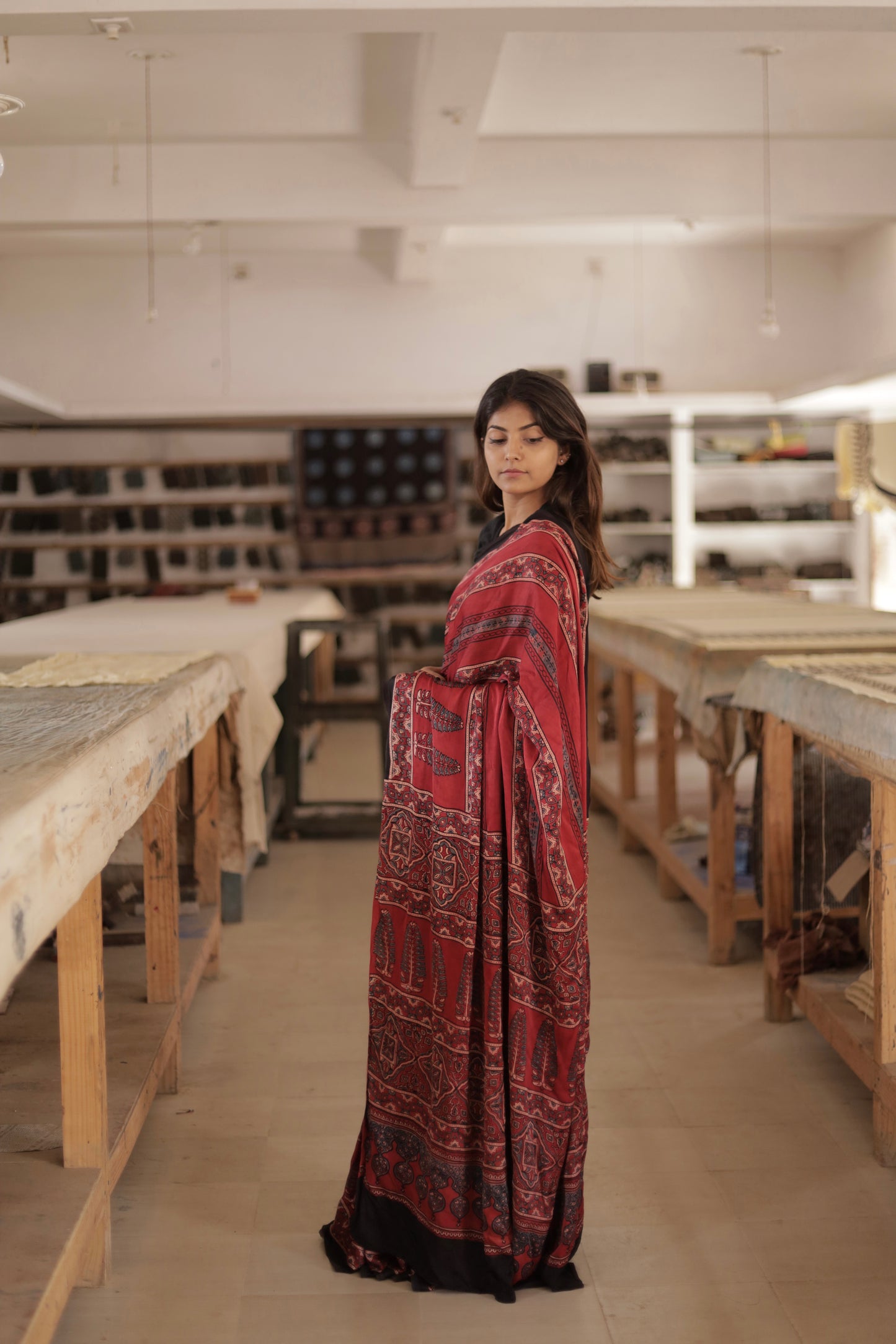 Elegant deep garnet Ajrakh saree crafted in luxurious modal silk with heritage-inspired designs