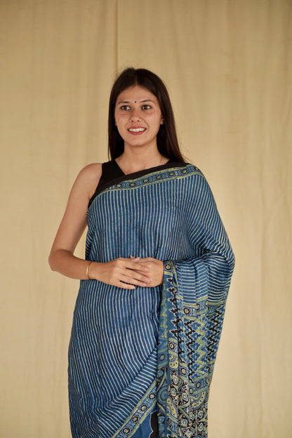 Elegant denim blue Ajrakh saree in modal silk showcasing skilled artisan block printing techniques