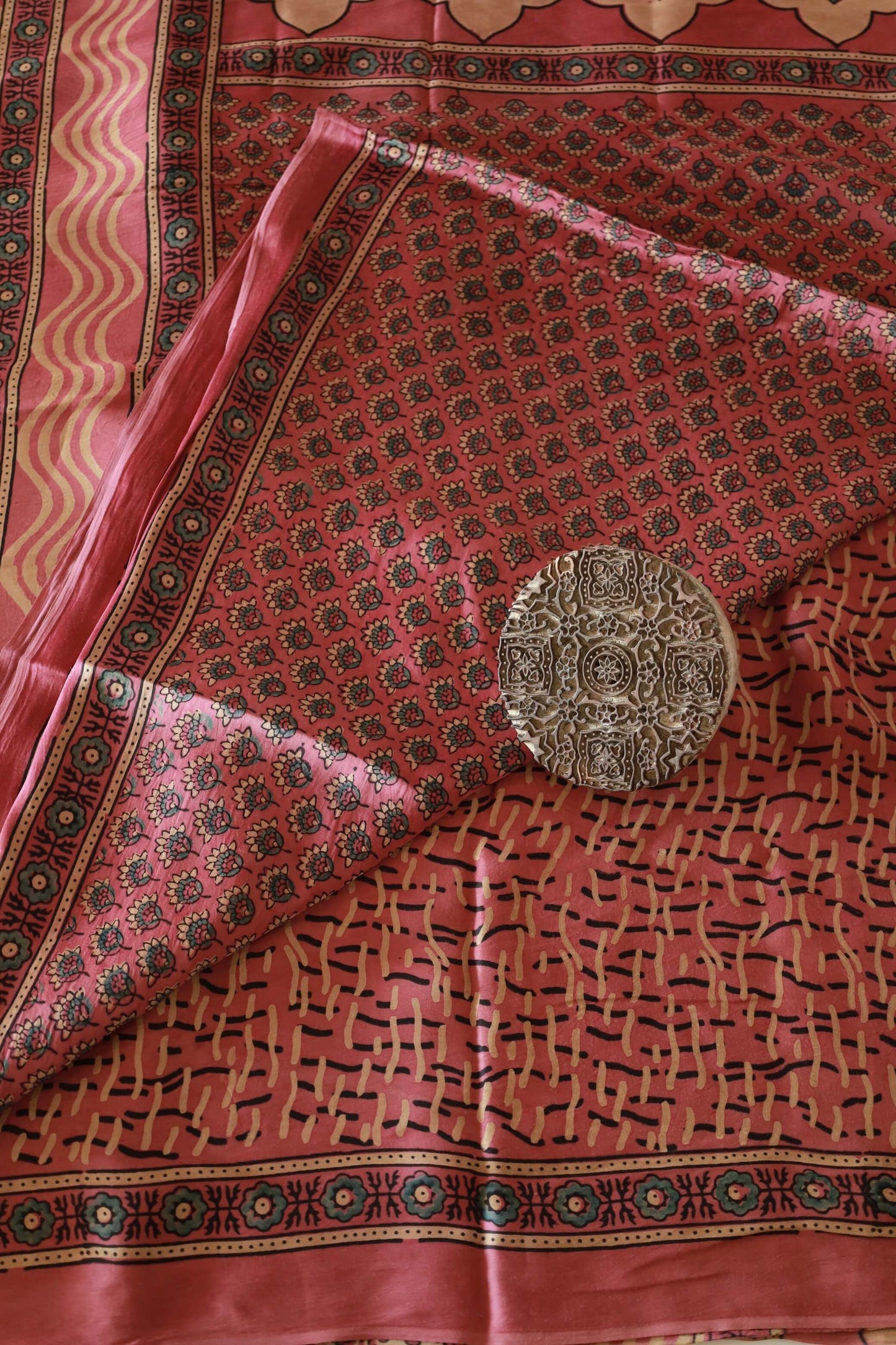 Elegant dusty rose flamingo Ajrakh saree crafted in luxurious modal silk with heritage-inspired designs
