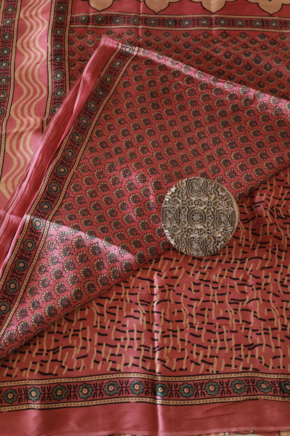 Elegant dusty rose flamingo Ajrakh saree crafted in luxurious modal silk with heritage-inspired designs