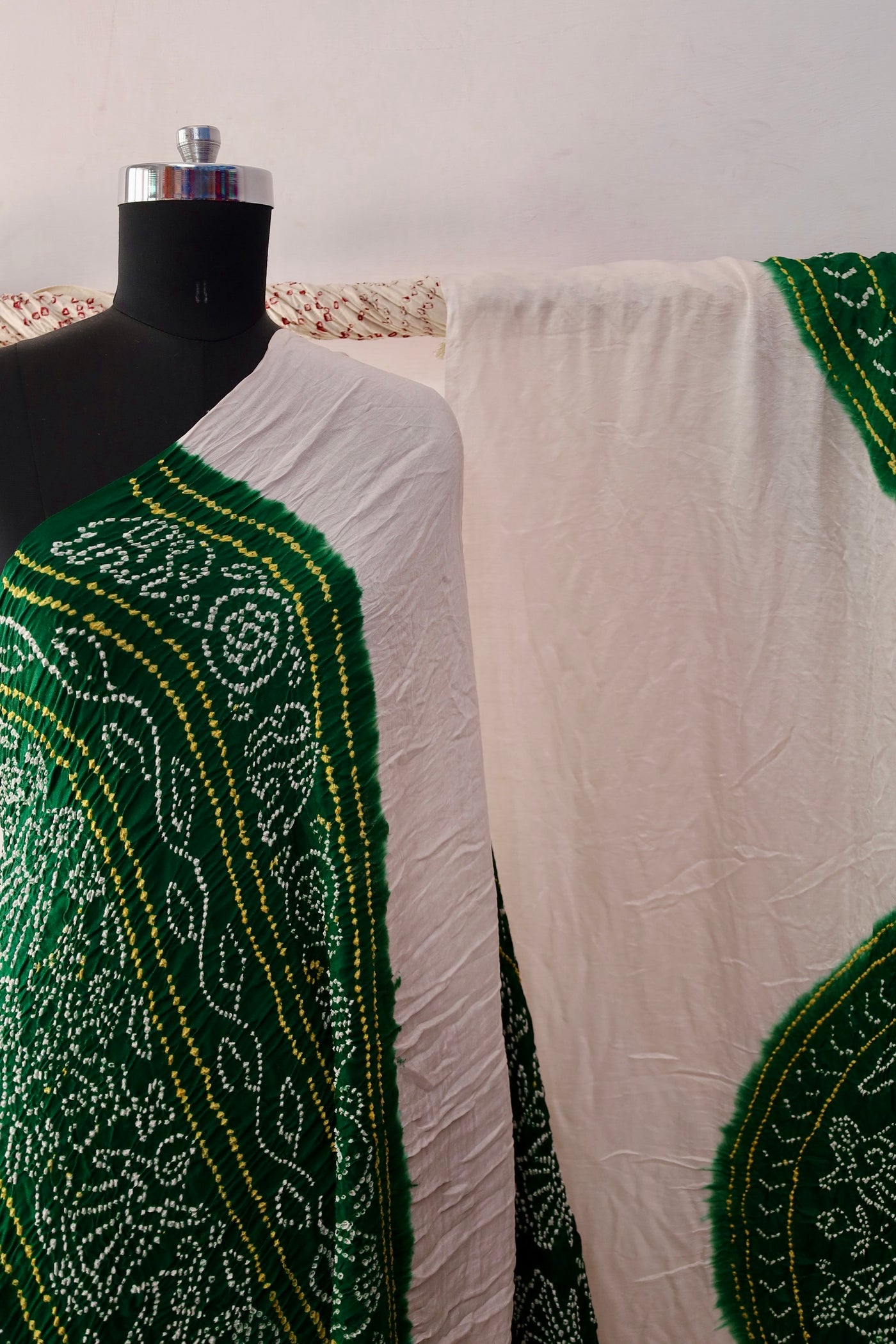 Emerald Bandhani Gajji silk saree featuring intricate tie-dye patterns and an elegant zari pallu