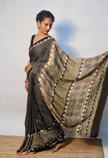 Elegant espresso brown Ajrakh saree in modal silk showcasing skilled artisan block printing techniques