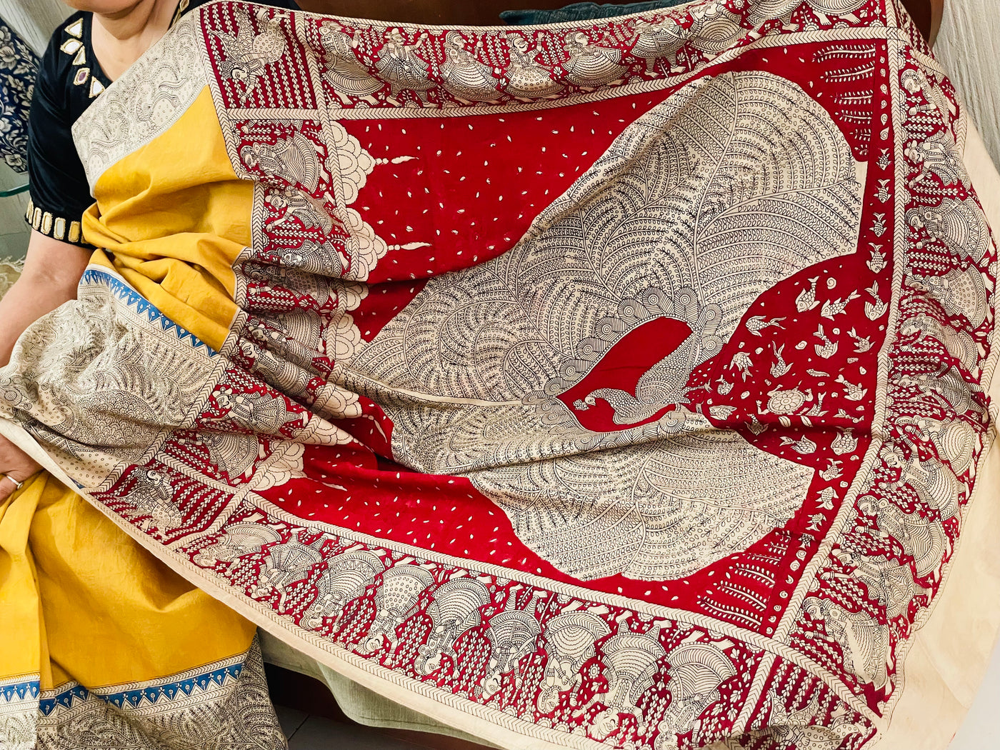 Elegant golden beige saree showcasing detailed Mata Ni Pachedi artwork created by skilled artisans