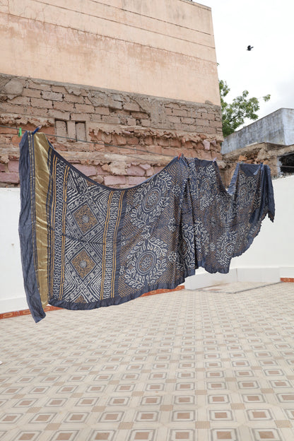 Handcrafted indigo silk saree showcasing authentic Rai Bandhani artistry with rich zari detailing