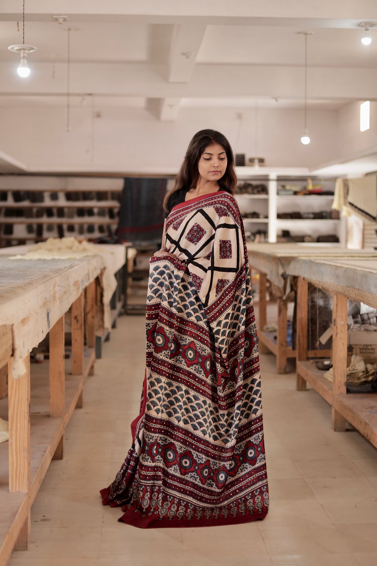 Elegant ivory black Ajrakh saree crafted in luxurious modal silk with heritage-inspired designs
