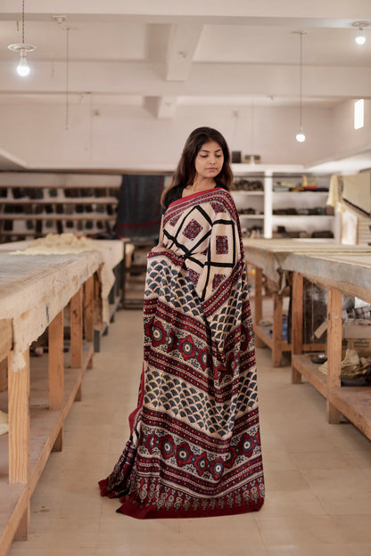 Elegant ivory black Ajrakh saree crafted in luxurious modal silk with heritage-inspired designs