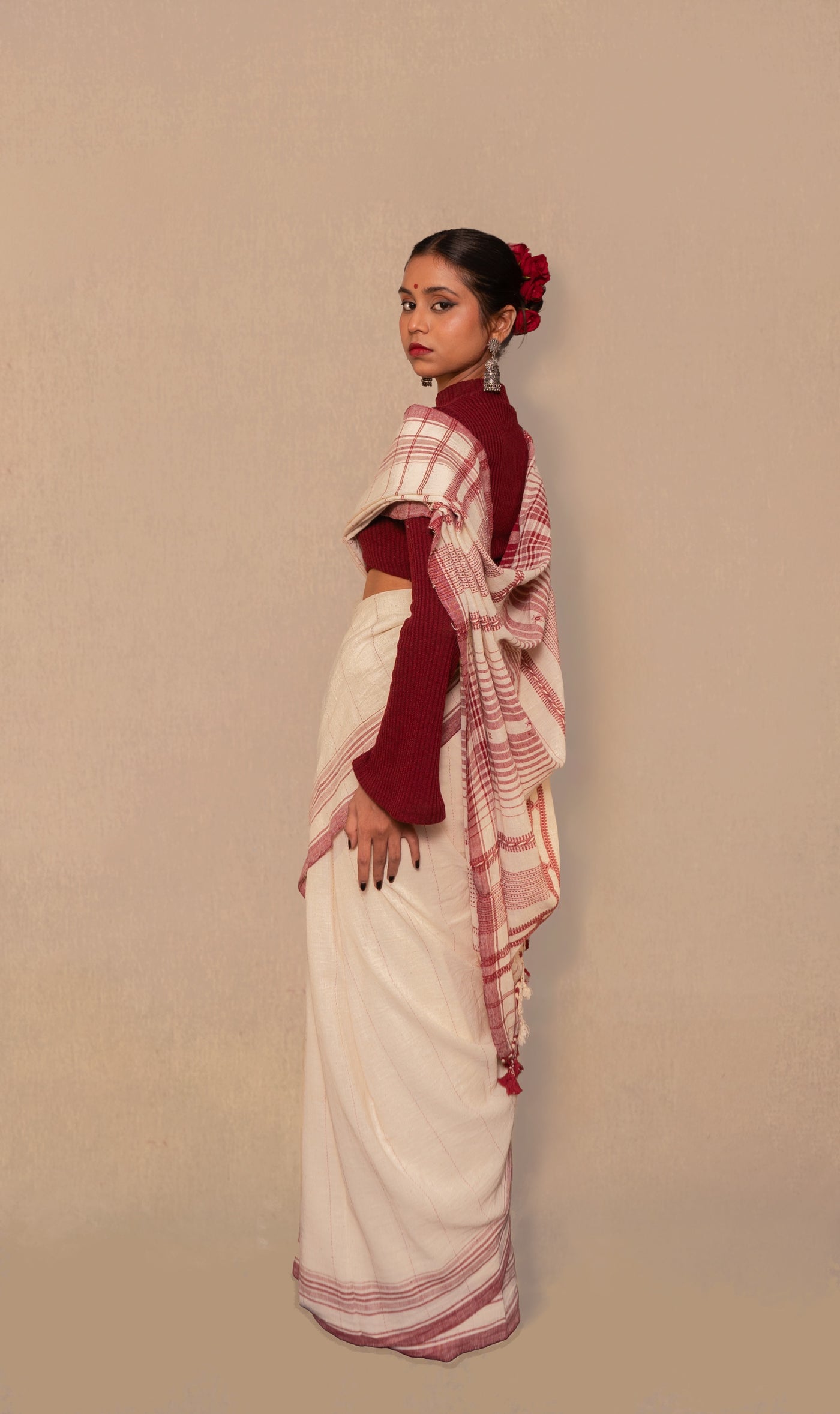 Elegant ivory Bhujodi saree woven in sustainable Kala Cotton with intricate artisan detailing