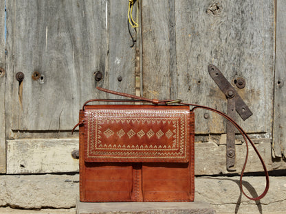 Handcrafted leather office bag showcasing decorative thread work and durable construction