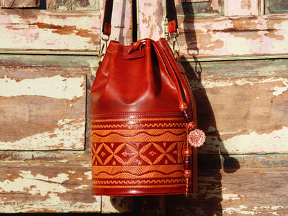 Artisan-made leather potli bag featuring traditional thread embroidery and fine detailing