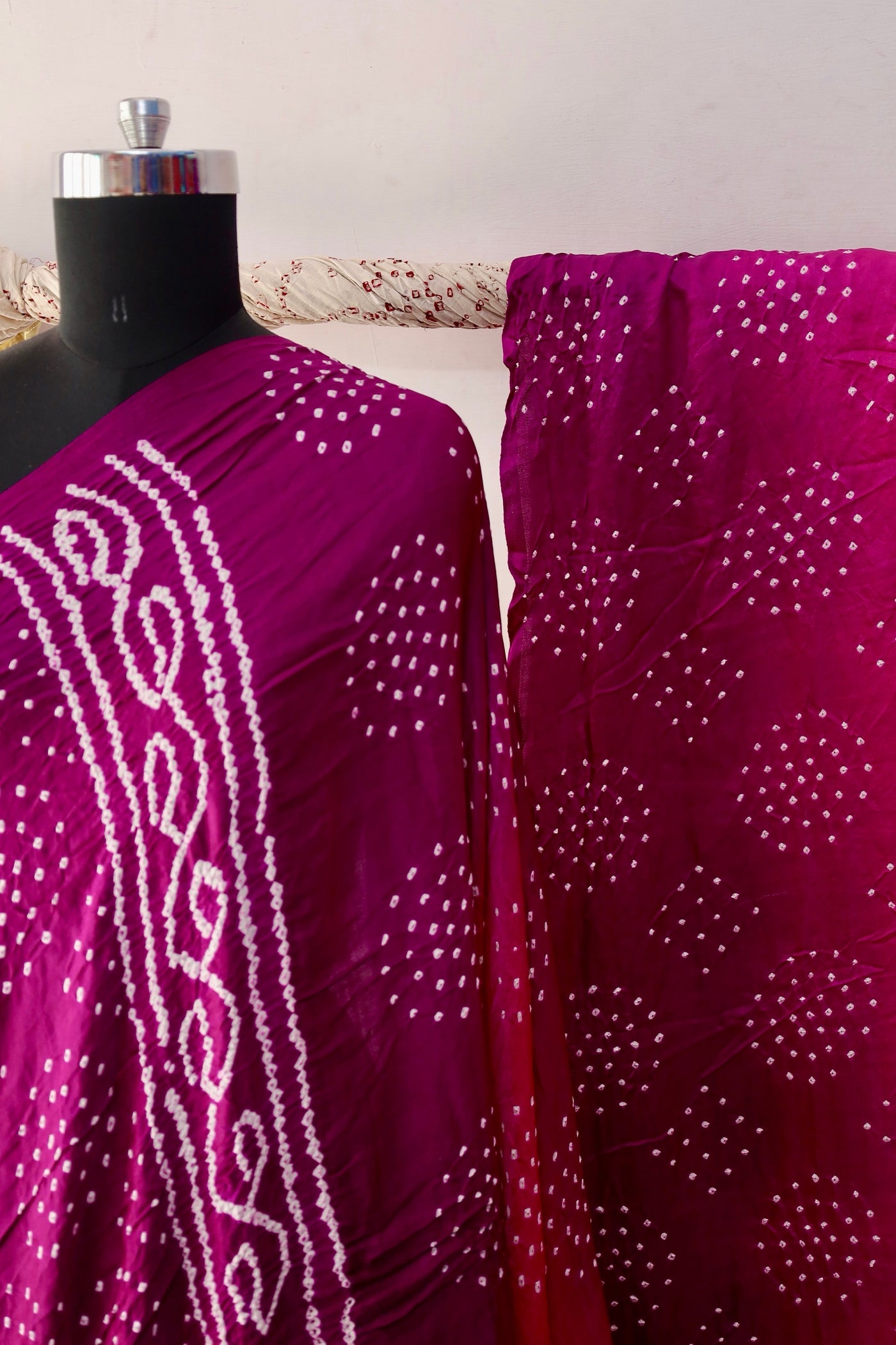 Magenta Bandhani Gajji silk saree featuring intricate tie-dye patterns and an elegant zari pallu