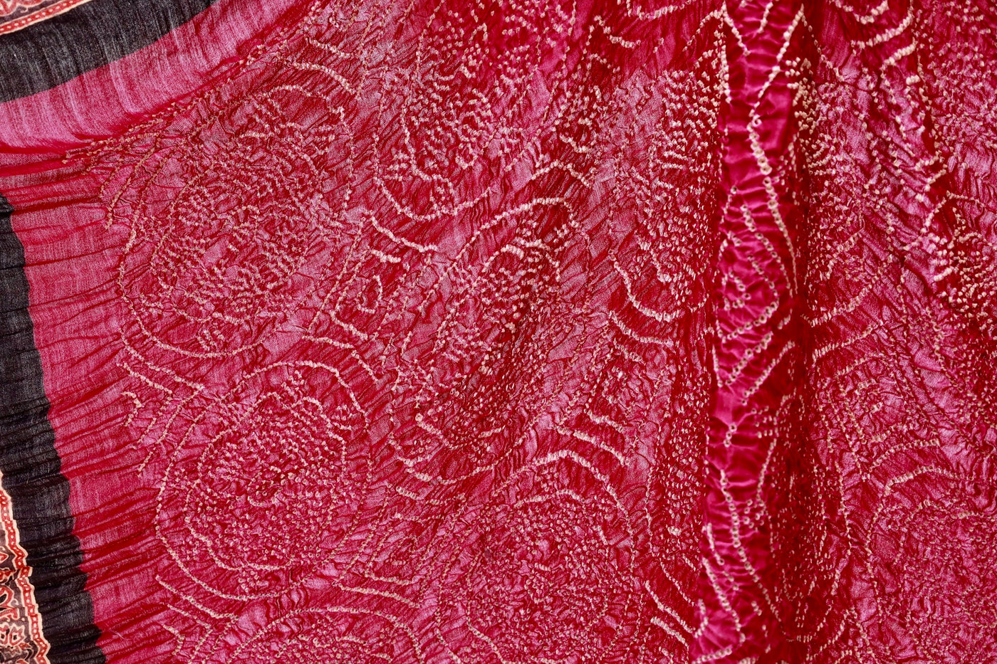 Handcrafted maroon silk saree showcasing authentic Ajrakh and Bandhani artisan craftsmanship