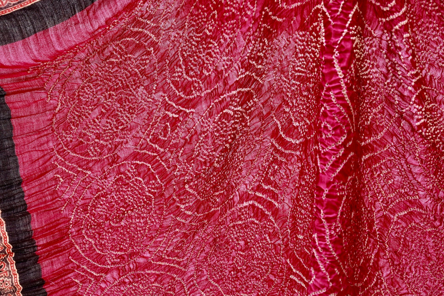 Handcrafted maroon silk saree showcasing authentic Ajrakh and Bandhani artisan craftsmanship