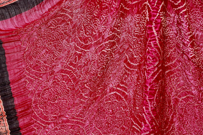 Handcrafted maroon silk saree showcasing authentic Ajrakh and Bandhani artisan craftsmanship