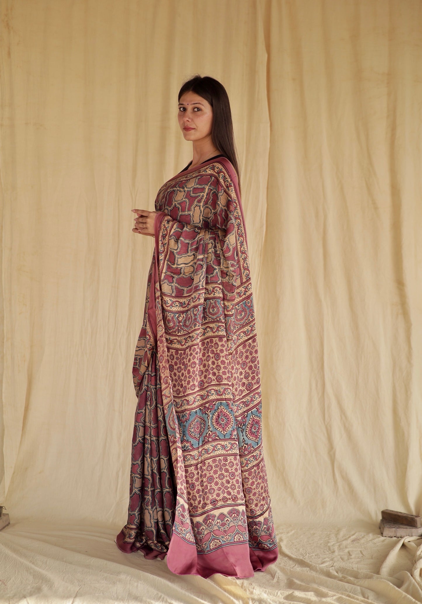 Elegant mauve pink Ajrakh saree in modal silk showcasing detailed artisan block printing techniques