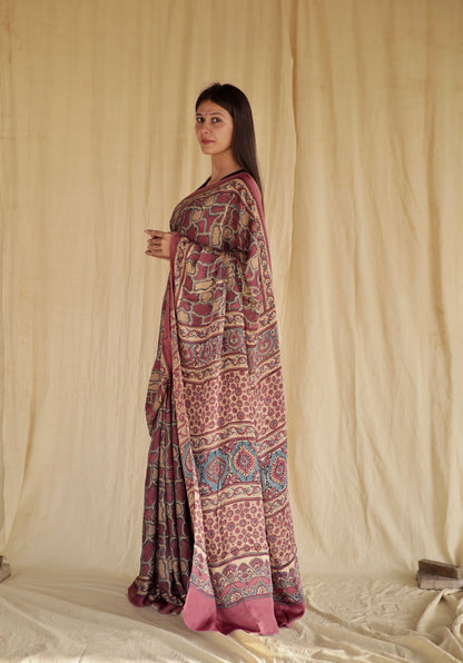 Elegant mauve pink Ajrakh saree in modal silk showcasing detailed artisan block printing techniques