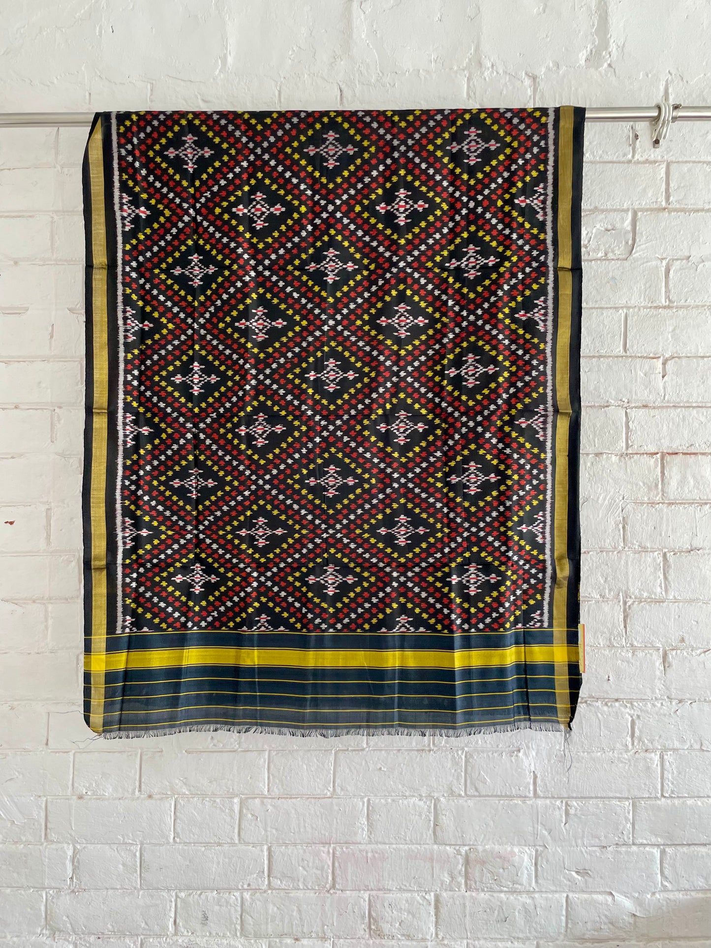 Handcrafted midnight black Patola dupatta showcasing authentic Single Ikkat weaving artistry