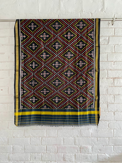Handcrafted midnight black Patola dupatta showcasing authentic Single Ikkat weaving artistry