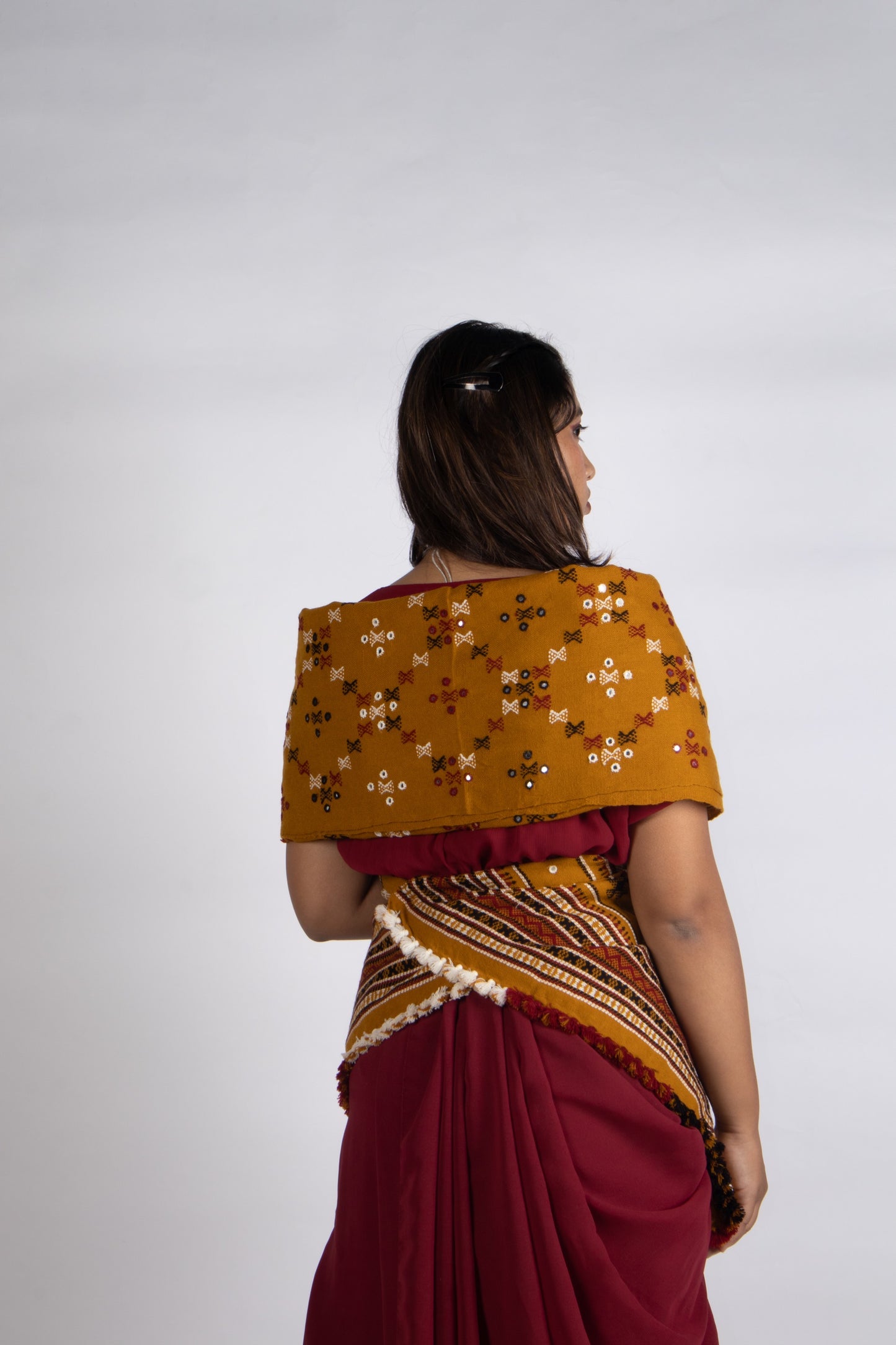 Classic handwoven woolen shawl in mustard gold designed for warmth, comfort, and festive styling