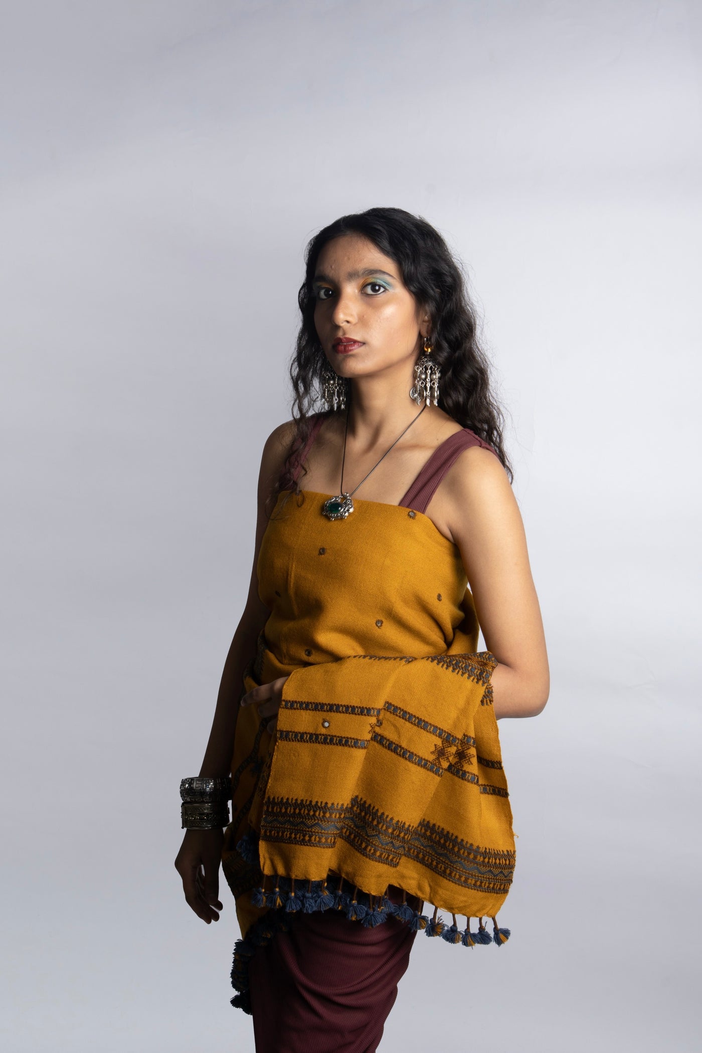 Traditional mustard wool shawl showcasing authentic weaving artistry and timeless appeal