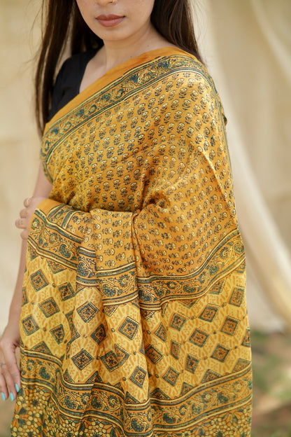 Elegant mustard yellow Ajrakh saree in Chanderi silk showcasing detailed artisan block printing