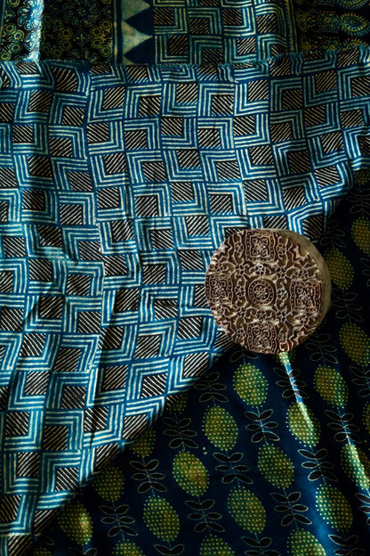 Elegant navy teal Ajrakh saree crafted in luxurious modal silk with heritage-inspired designs
