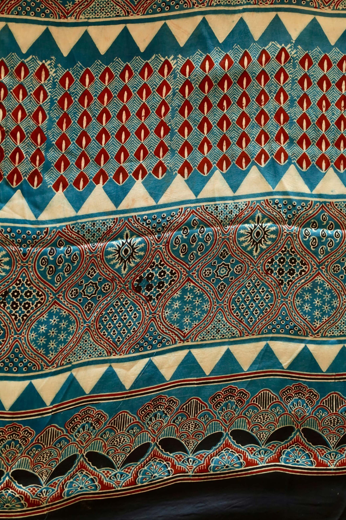 Premium ocean blue modal silk saree showcasing authentic Ajrakh craftsmanship and timeless motifs