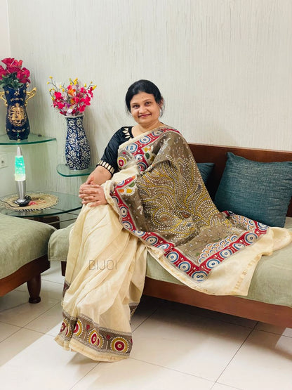 Elegant olive branch saree showcasing detailed Mata Ni Pachedi artwork created by skilled artisans