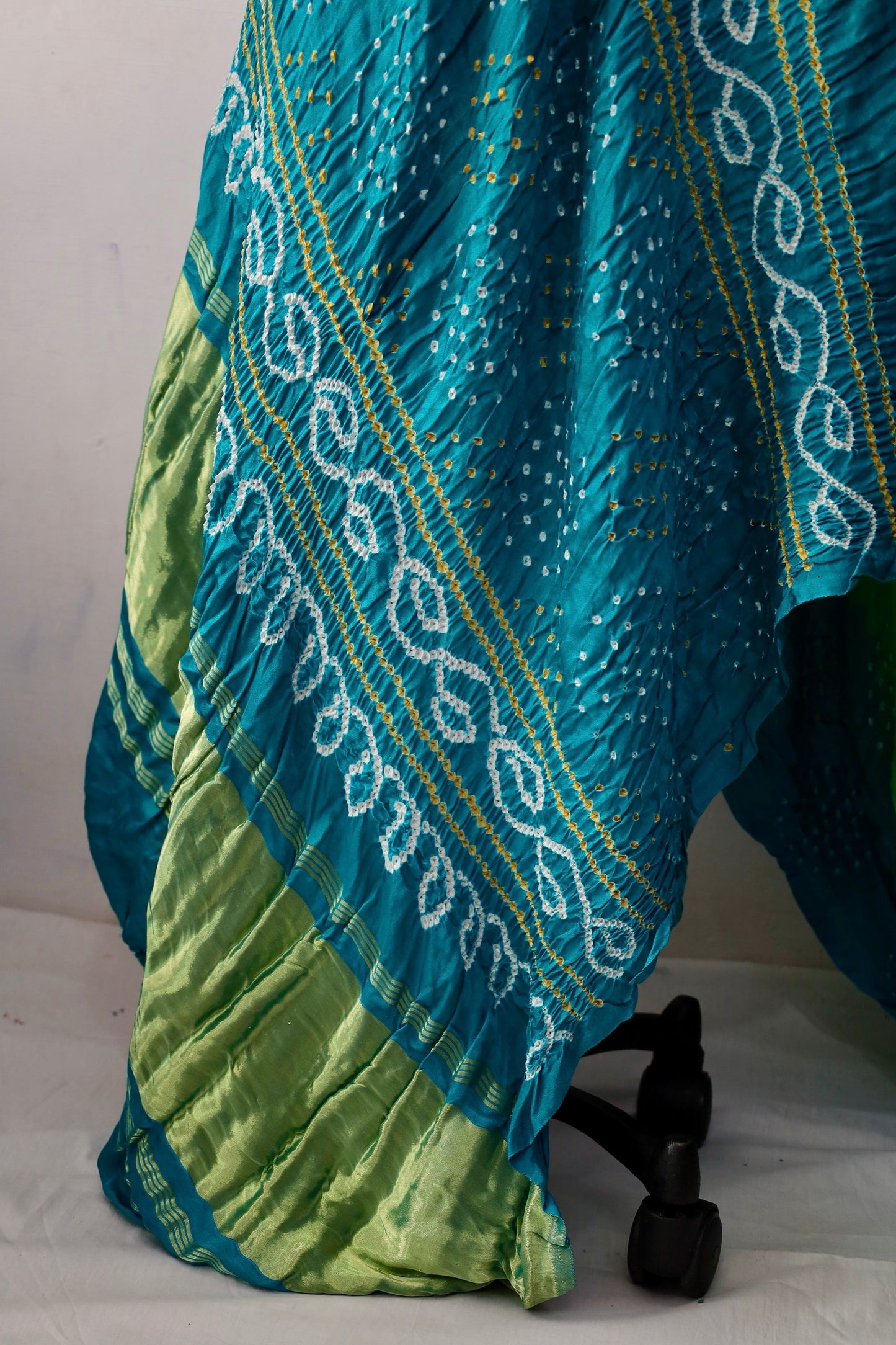 Handcrafted peacock Gajji silk saree showcasing authentic Bandhani artistry with rich zari detailing
