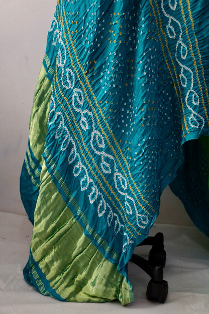Handcrafted peacock Gajji silk saree showcasing authentic Bandhani artistry with rich zari detailing