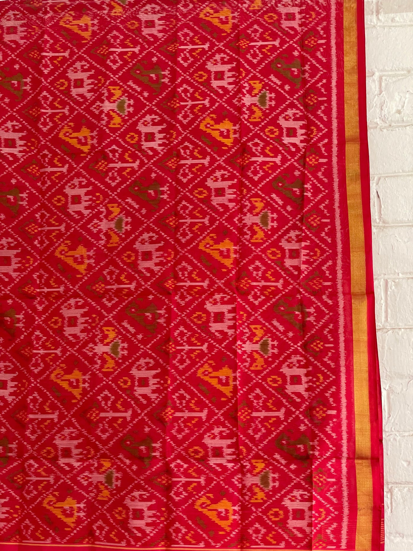 Handcrafted red Patola dupatta showcasing authentic Single Ikkat weaving artistry