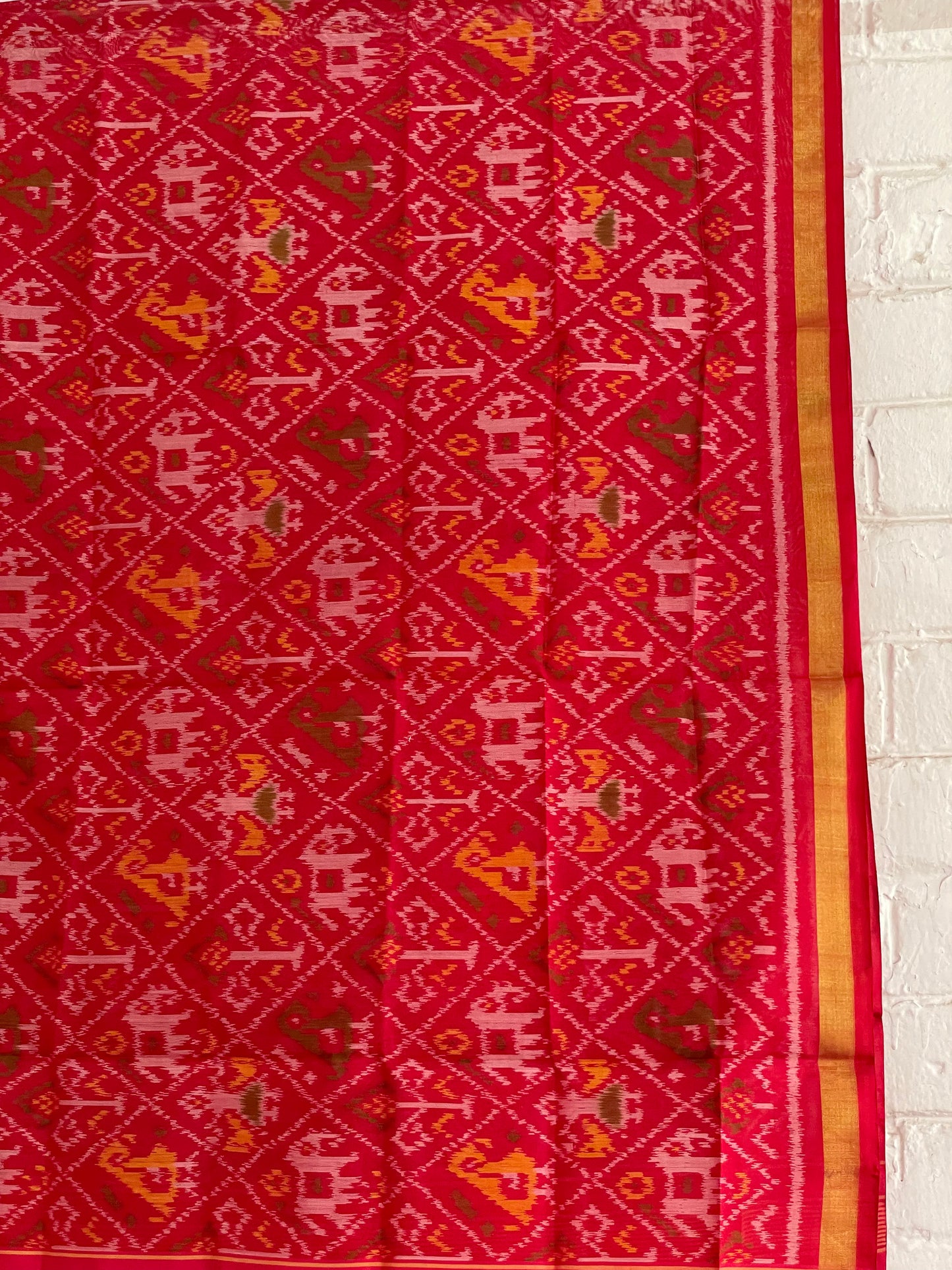 Handcrafted red Patola dupatta showcasing authentic Single Ikkat weaving artistry