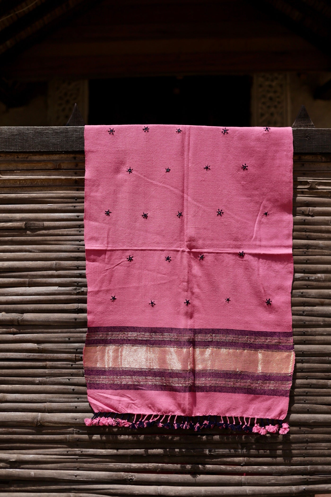 Classic handwoven woolen stole in rose blush designed for warmth, comfort, and sophisticated styling